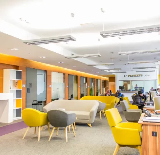 University recreational area with support staff at desks