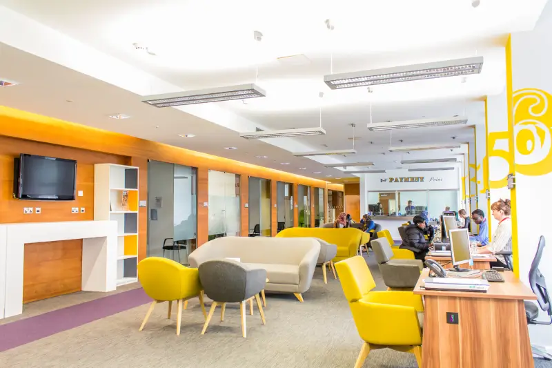 University recreational area with support staff at desks