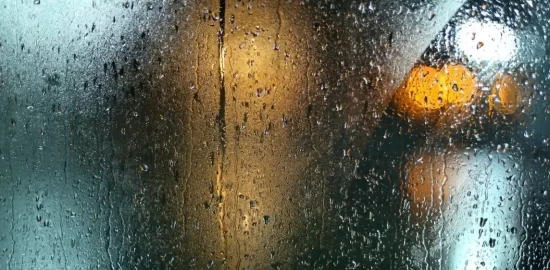 A misty window with condensation on it