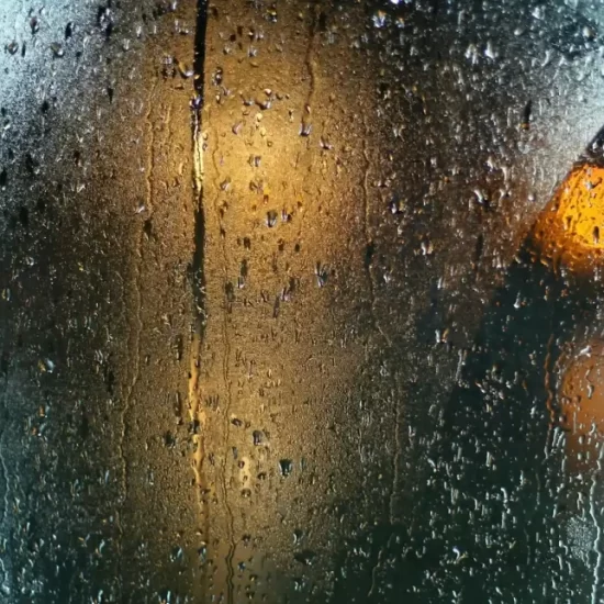 A misty window with condensation on it