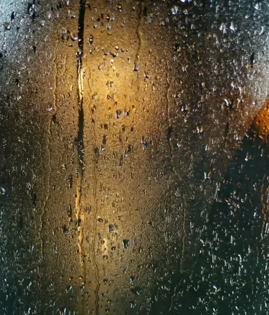 A misty window with condensation on it