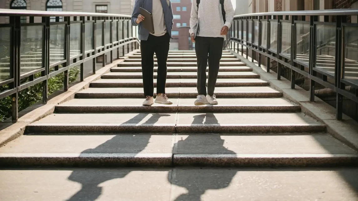 Student's walking down university steps