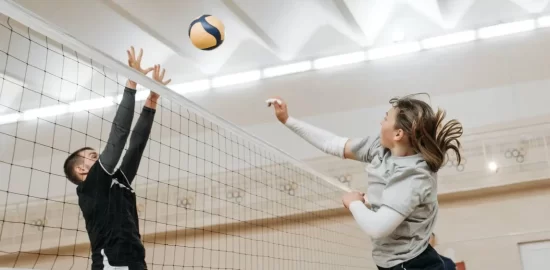 Volley ball being played in a sports hall