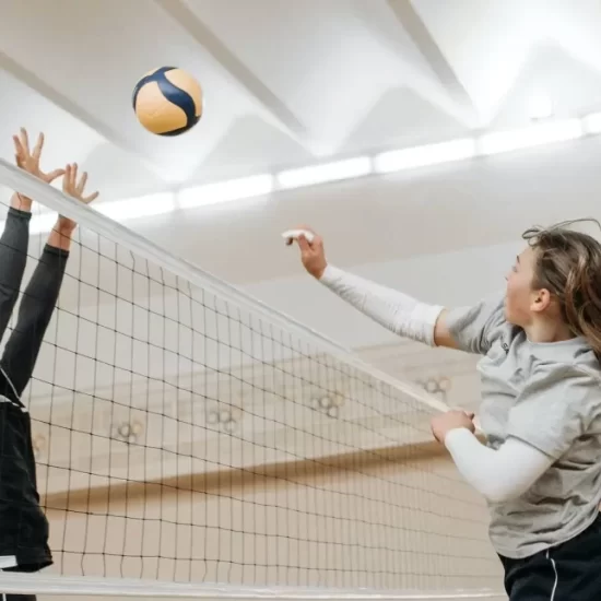 Volley ball being played in a sports hall