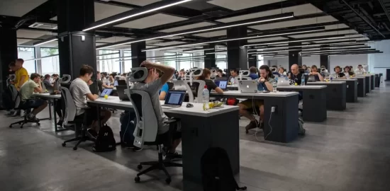 Busy office with direct overhead linear lighting